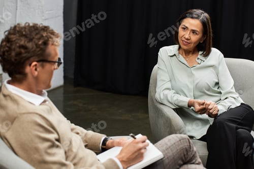 Preview: Journalist interviews an expert in a cozy studio, capturing her insights and expertise