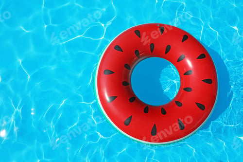Preview: Inflatable ring floating in swimming pool on sunny day, top view with space for text