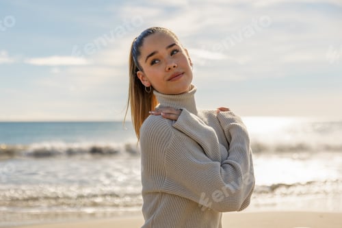 Preview: Portrait of a young pretty girl on the background of the sea