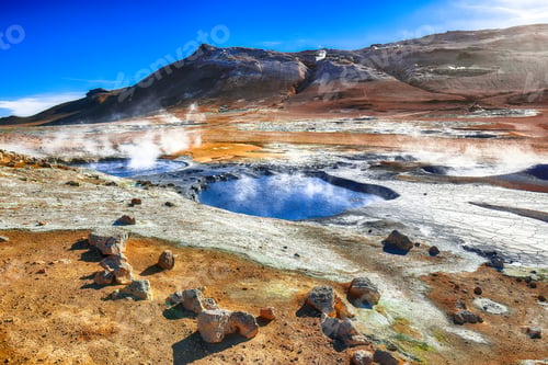 Preview: Boiling mudpots in the geothermal area Hverir and cracked ground around.