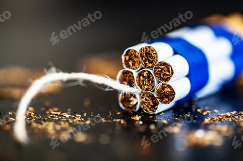 Preview: Stop smoking concept on background with broken cigarettes. Heap of cigarettes. No smoking