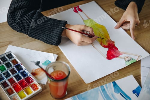 Preview: Fashion Designer Creating Watercolor Dress Sketch