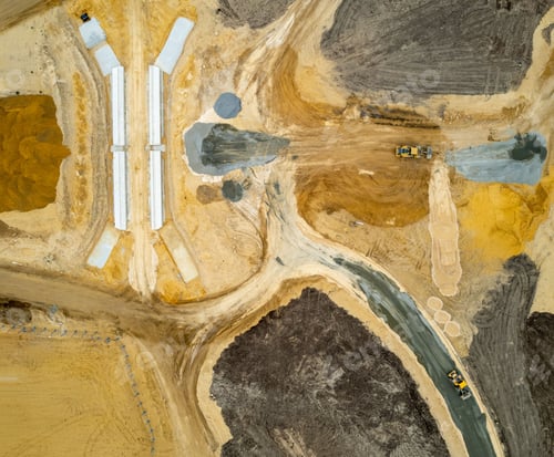 Preview: Aerial view of the construction of a freeway with interesting textures and patterns.