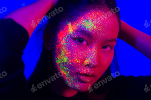 Preview: Fashion model with fluo painting on the face