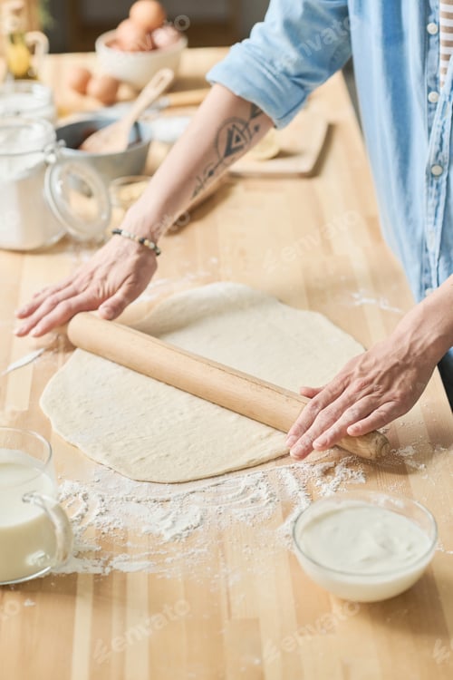 Preview: Housewife working with rolling pin