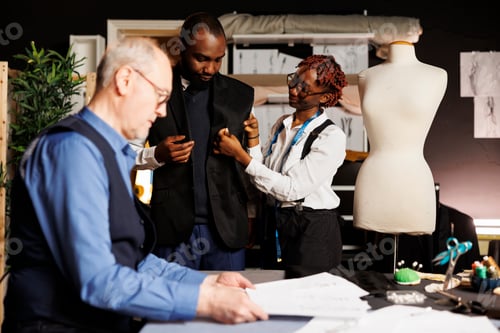 Preview: Seamstress assistant helping client