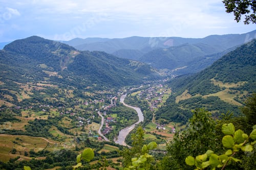 Preview: Carpathian Mountains Range, Ukraine. Carpathian view of a mountain river and village