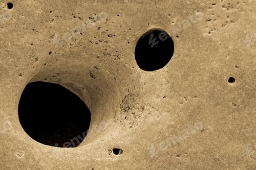 Preview: Closeup Of Texture Of A Stone Surface With Two Big Holes For The Natural Textured Background Or For