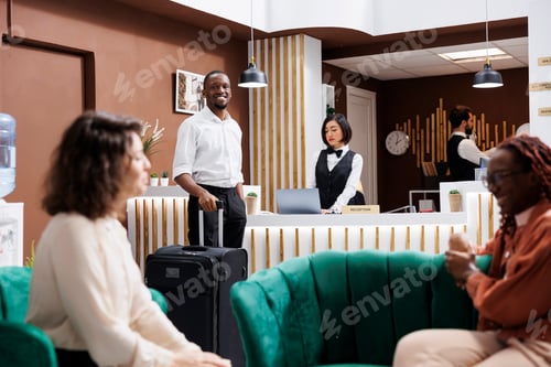 Preview: African american guest arriving at hotel