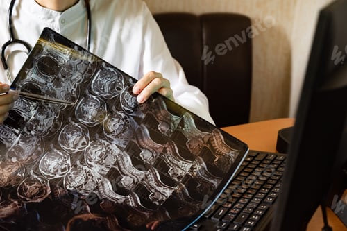Preview: Medical professional examines chest X-ray in a well-lit hospital room