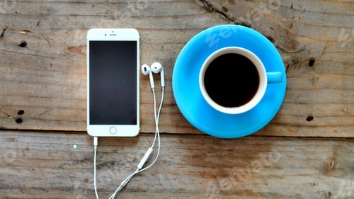 Preview: Smartphone and coffee cup on wooden table