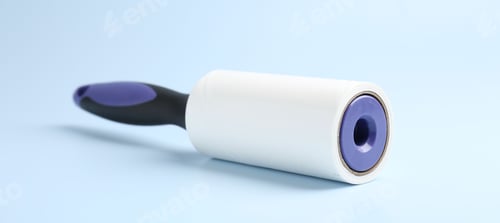 Preview: One lint roller on light blue background, closeup