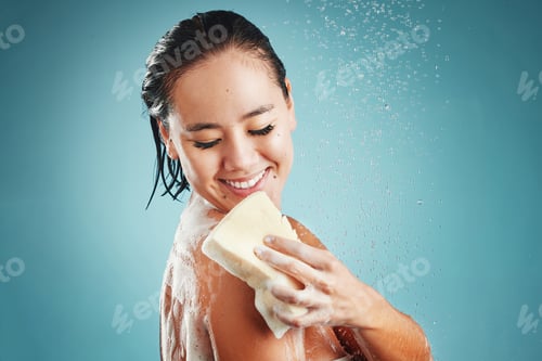Preview: Studio, skincare and woman in shower with sponge isolated on a blue background mockup. Water splash