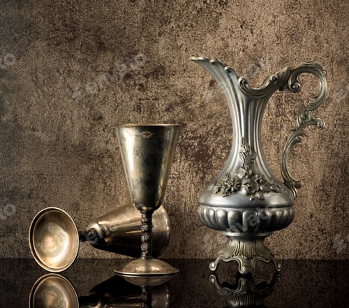 Preview: Still life with Ancient jug for wine and silver goblets on a stone background