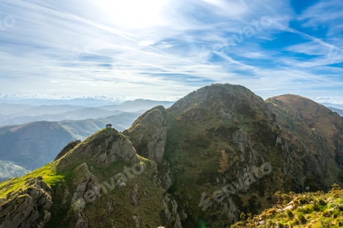 Preview: Hikers contemplating breathtaking view from mount aiako harria in oiartzun, basque country