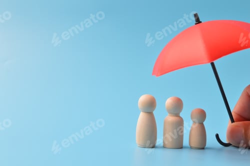 Preview: Red toy umbrella isolated on a blue background. Insurance coverage concept