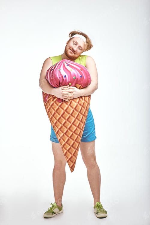 Preview: Red haired, bearded, plump man is holding a big ice cream