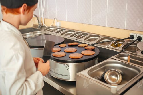 Preview: red-haired boy in chef's costume
