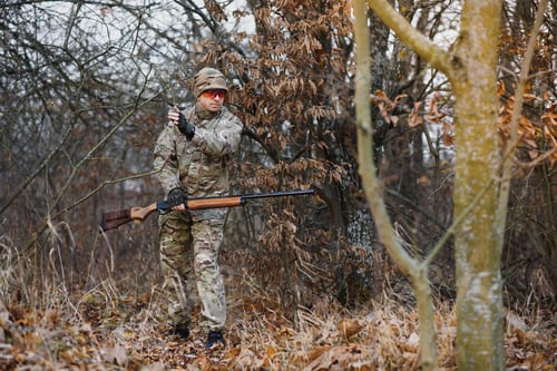 Preview: Hunting permit. Man brutal gamekeeper nature background. hunter spend leisure hunting.