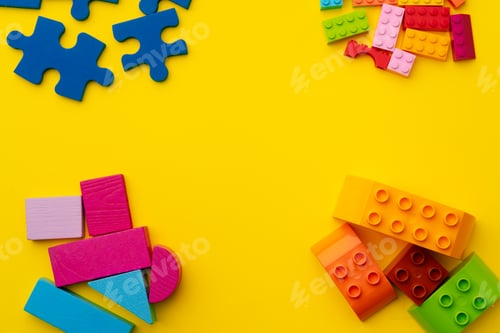 Preview: Toy kid's constructor on yellow background top view