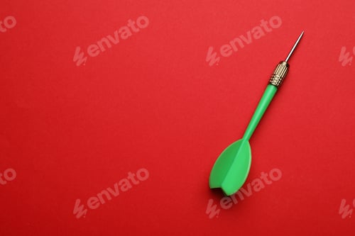 Preview: Green dart arrow on red background, top view with space for text