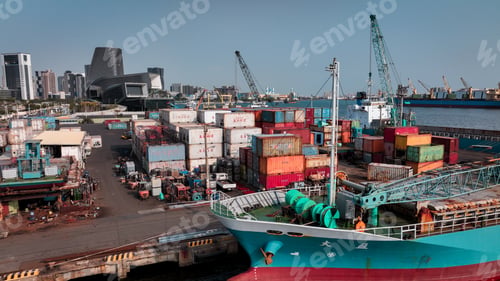 Preview: Busy container terminal in Kaohsiung Taiwan with cargo ships and city skyline in view
