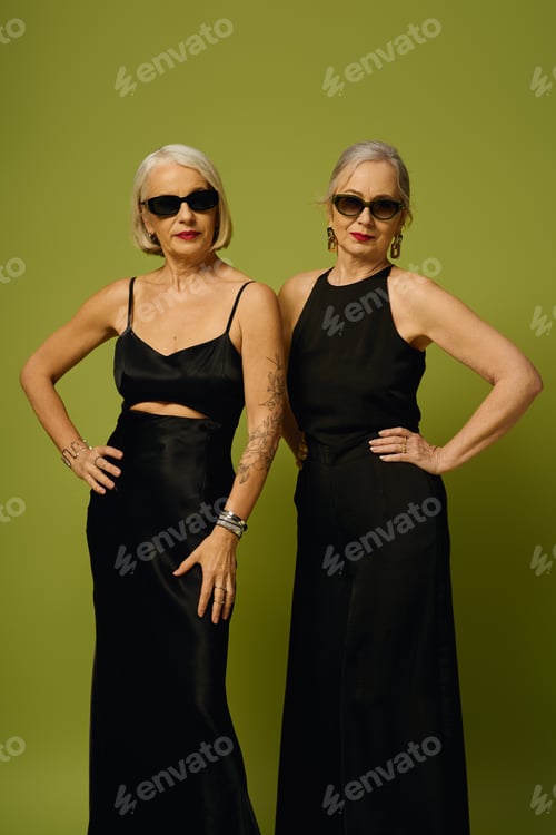 Preview: Stylish mature lesbian couple showcasing elegance and confidence in vibrant setting