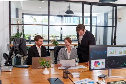 Preview: Team meeting in a modern office discussing financial reports and strategies