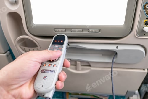 Preview: Hand holding remote with blank display