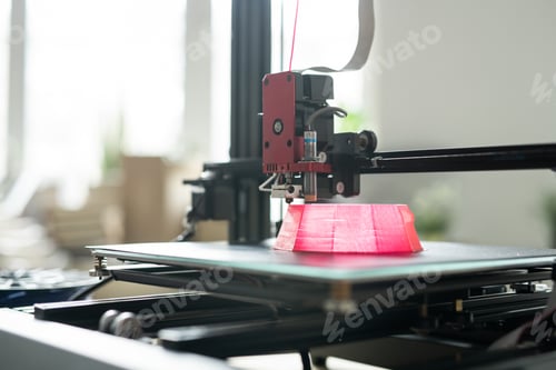 Preview: Printhead of 3d printer moving over foundation of pink round object