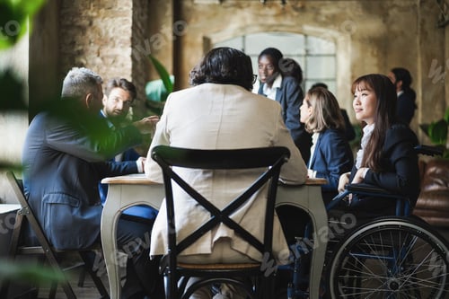 Preview: Multiracial business people working inside office - Focus on asian woman sitting on wheelchair