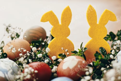 Preview: Natural dyed easter eggs and rabbit decorations on wooden background