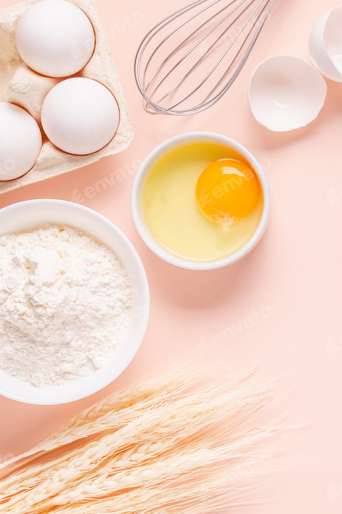 Preview: Ingredients for baking on light pink background.