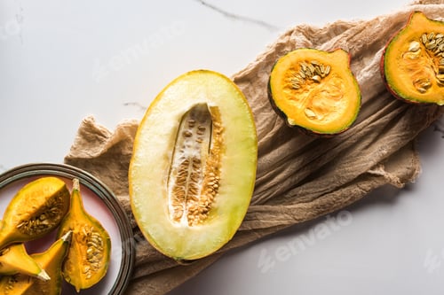 Preview: Top View of Melon Half And Plate With Pumpkin on Canvas