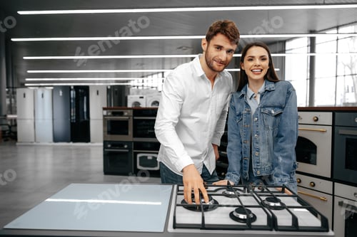 Preview: Happy smiling couple just bought new household appliances in hypermarket