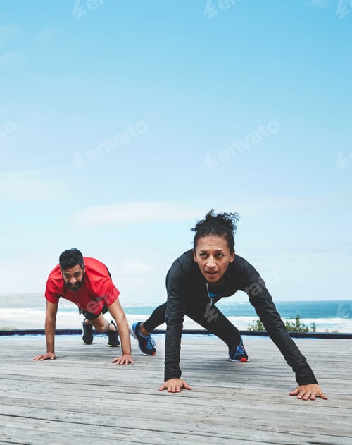 Preview: Theres nothing like an outdoors workout to test your limits. Shot of a couple doing push-ups.