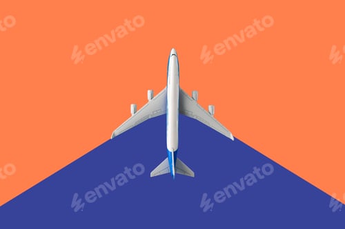 Preview: a top view of a plane on a two color backgroind creative travel concept and copy space