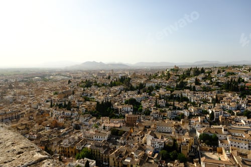 Preview: Panoramic View of the Beautiful Old Town Granada in Spain, lit in hazy Evening Light