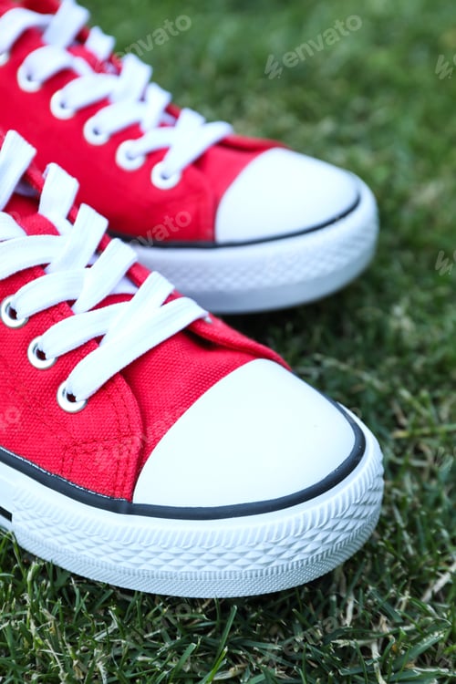 Preview: Stylish, red, women's sneakers on the grass
