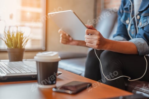 Preview: The hand women hold labtop to the watching or shopping is relaxing during coffe break after work