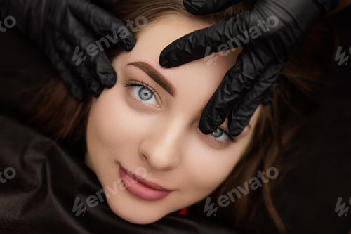 Preview: Photo after correction of permanent eyebrow makeup posing in front of the camera