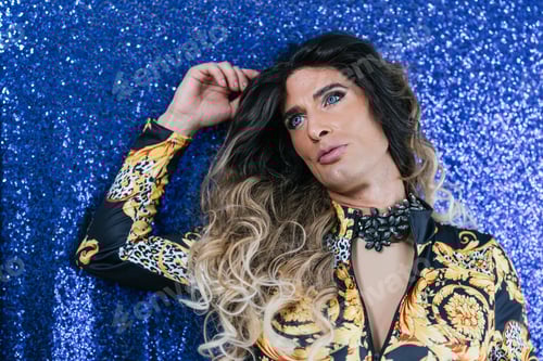 Preview: Person with long hair and patterned top posing