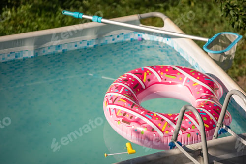 Preview: An above ground pool in the backyard on a sunny summer day.