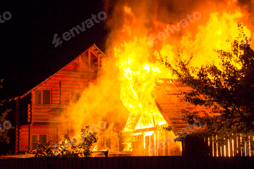 Preview: Burning wooden house at night. Bright orange flames and dense smoke
