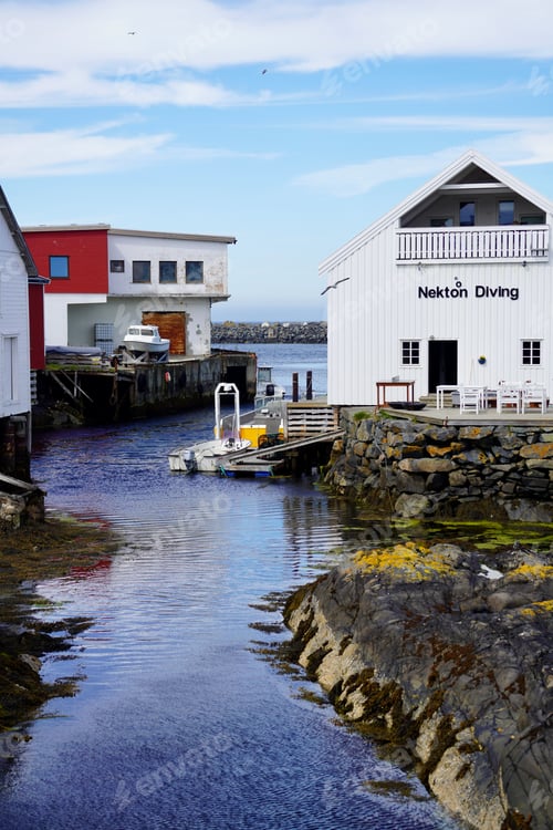 Preview: Waterfront with diving center and boats in small harbor town