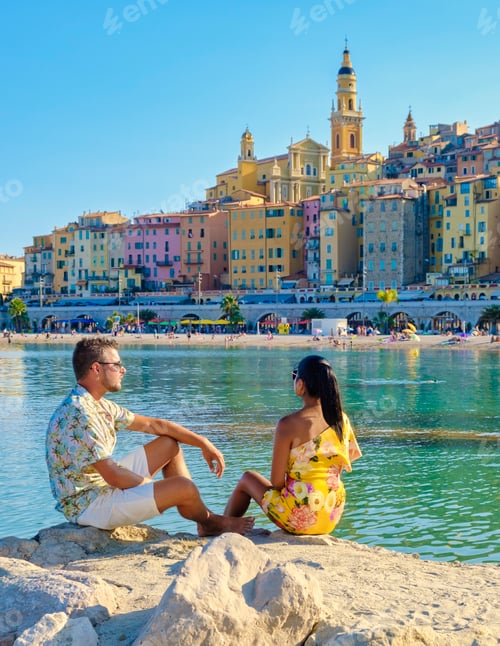 Preview: Menton France,couple men and woman on vacation at the Cote d Azur France, View on old part of Menton