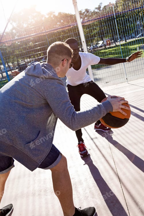 Preview: Group of friends playing basketball.