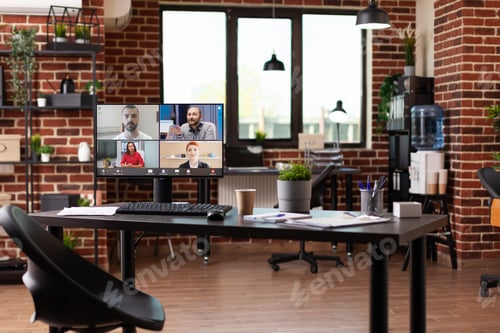 Preview: Video call communication with colleagues on computer in empty business office