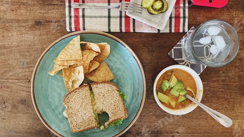 Lunch Meal on Wood Table, Sandwich and Chips