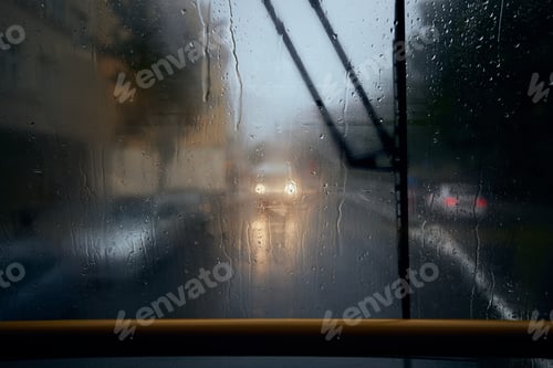 Preview: Traffic in city street during heavy rain